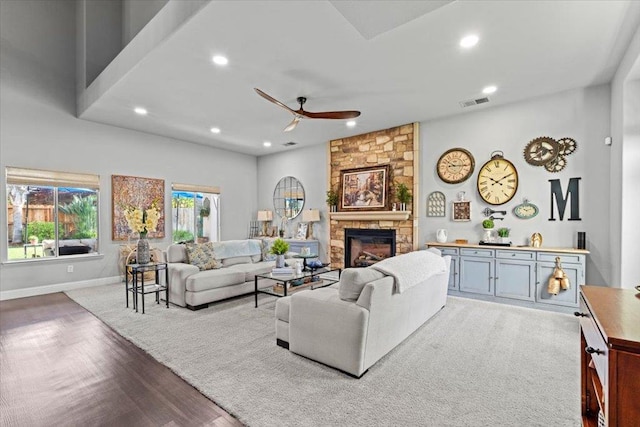 1117 E Royal Dornoch Ave, Fresno, CA 93730 - living area featuring a ceiling fan, wood finished floors, recessed lighting, a stone fireplace, and baseboards