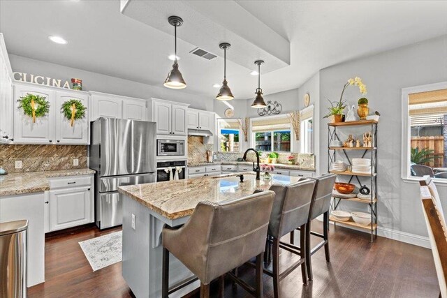 1117 E Royal Dornoch Ave, Fresno, CA 93730 - kitchen with appliances with stainless steel finishes, a sink, white cabinets, decorative backsplash, and recessed lighting