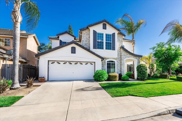 1117 E Royal Dornoch Ave, Fresno, CA 93730 - view of front of property featuring stucco siding, concrete driveway, stone siding, and a garage