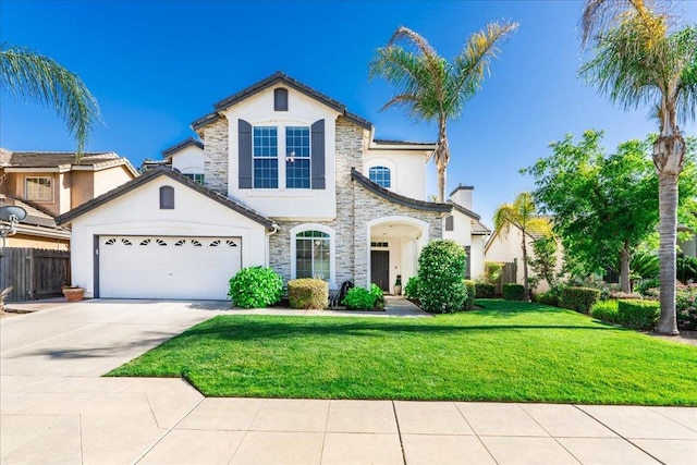 1117 E Royal Dornoch Ave, Fresno, CA 93730 - view of front of property with stone siding, stucco siding, driveway, and a garage
