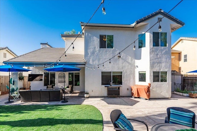 1117 E Royal Dornoch Ave, Fresno, CA 93730 - back of property with an outdoor living space, a patio area, stucco siding, and a tiled roof