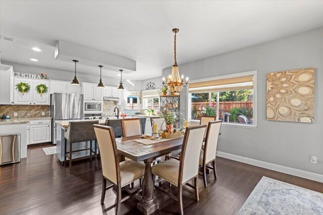 1117 E Royal Dornoch Ave, Fresno, CA 93730 - dining space featuring a chandelier, dark wood finished floors, baseboards, and recessed lighting