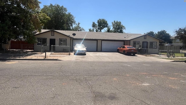 2645 W Robinson Ave, Fresno, CA 93705 - ranch-style home with a garage, driveway, and fence