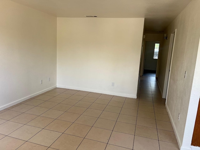 2645 W Robinson Ave, Fresno, CA 93705 - empty room with light tile patterned floors and baseboards