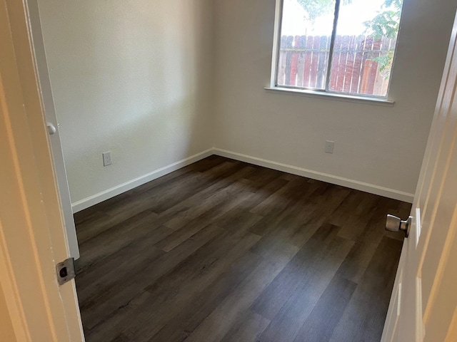 2645 W Robinson Ave, Fresno, CA 93705 - unfurnished room with baseboards and dark wood finished floors