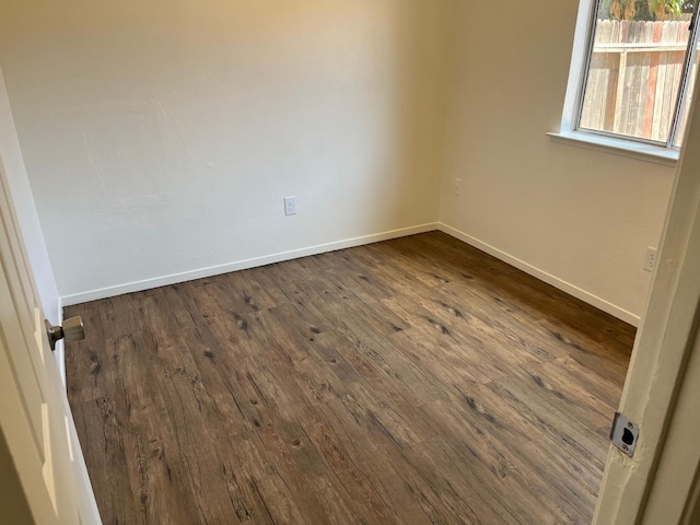 2645 W Robinson Ave, Fresno, CA 93705 - empty room with dark wood-style floors and baseboards