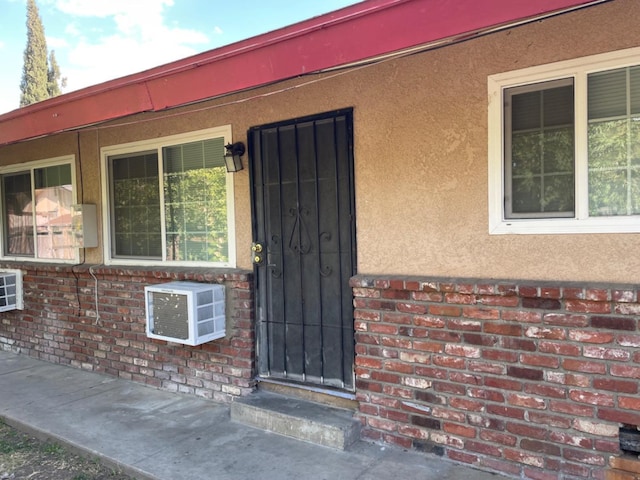 408 S Woodrow Ave, Fresno, CA 93702 - doorway to property featuring stucco siding and brick siding
