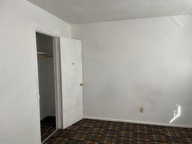 408 S Woodrow Ave, Fresno, CA 93702 - unfurnished bedroom featuring a textured ceiling and a closet