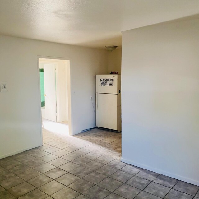 408 S Woodrow Ave, Fresno, CA 93702 - spare room featuring baseboards