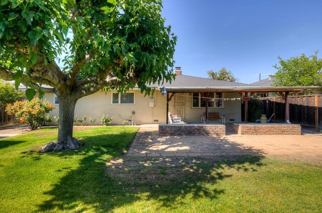 3948 E Fedora Ave, Fresno, CA 93726 - ranch-style house with a patio, a chimney, and stucco siding