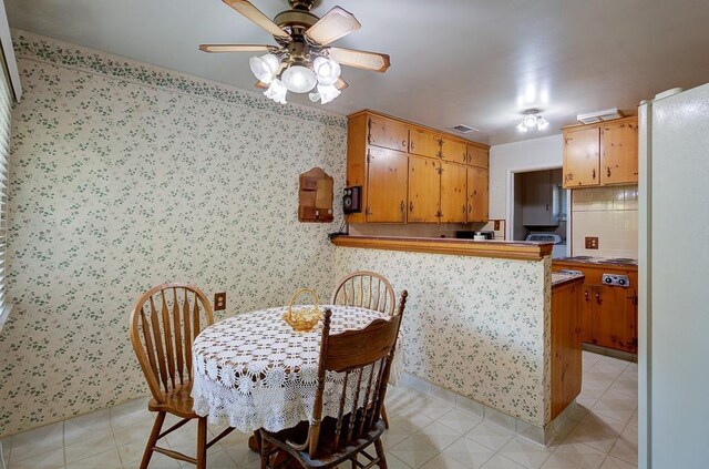 3948 E Fedora Ave, Fresno, CA 93726 - dining room featuring a ceiling fan and wallpapered walls