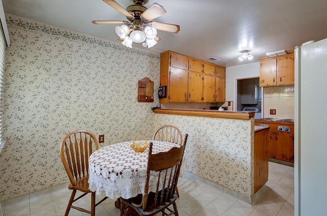 3948 E Fedora Ave, Fresno, CA 93726 - dining space featuring ceiling fan and wallpapered walls