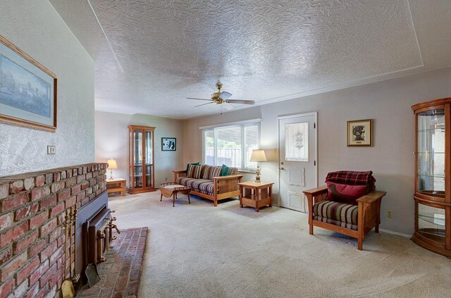 3948 E Fedora Ave, Fresno, CA 93726 - carpeted living area featuring a ceiling fan, a textured ceiling, and a fireplace