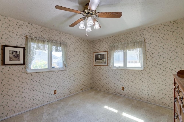 3948 E Fedora Ave, Fresno, CA 93726 - carpeted empty room featuring ceiling fan and wallpapered walls