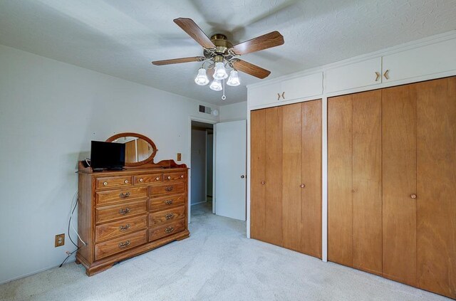 3948 E Fedora Ave, Fresno, CA 93726 - bedroom with light colored carpet, multiple closets, and a ceiling fan