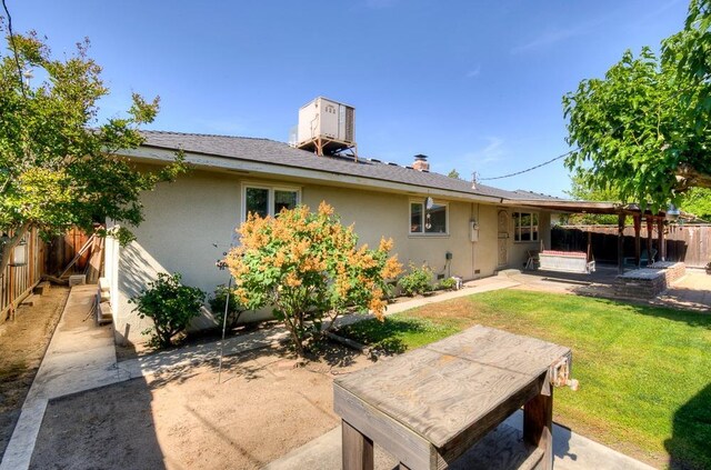 3948 E Fedora Ave, Fresno, CA 93726 - rear view of property featuring a patio area, a fenced backyard, and stucco siding