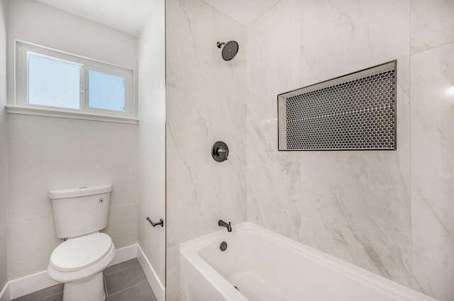 full bath featuring toilet,  shower combination, baseboards, and tile patterned flooring