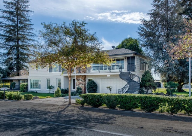 13155 W Shaw Ave, Kerman, CA 93630 - view of front of home with concrete driveway and a garage