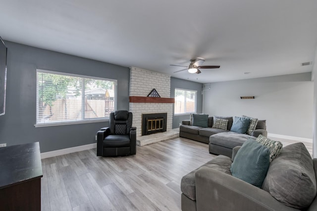 2983 E Northdale Ave, Fresno, CA 93726 - living area with ceiling fan, a brick fireplace, baseboards, and light wood-style flooring