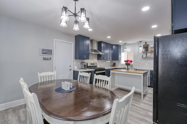 2983 E Northdale Ave, Fresno, CA 93726 - dining room with recessed lighting, a chandelier, baseboards, and light wood-style flooring