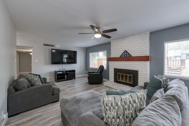 2983 E Northdale Ave, Fresno, CA 93726 - living room featuring ceiling fan, wood finished floors, a fireplace, and baseboards