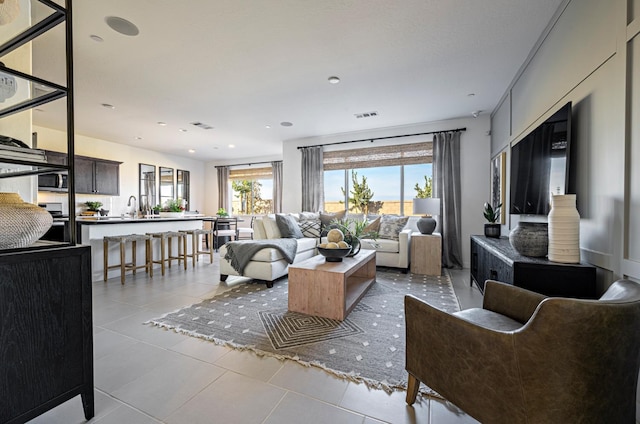 1163 Maclure Ave W, Madera, CA 93636 - living area featuring plenty of natural light, light tile patterned floors, and recessed lighting
