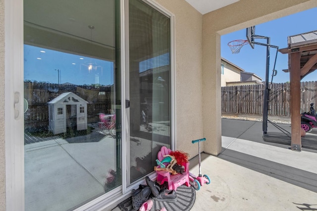 view of patio / terrace featuring fence