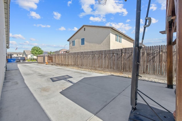view of patio featuring fence