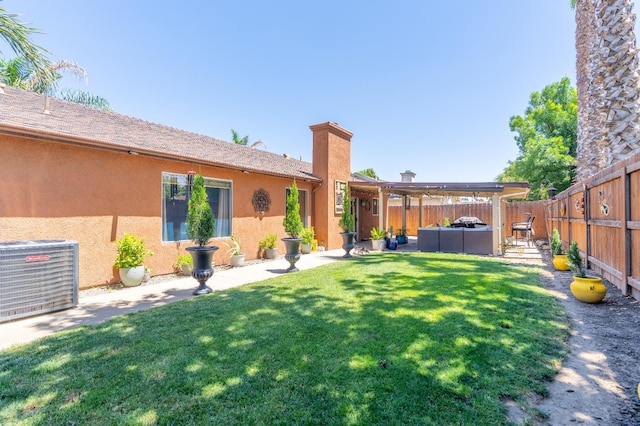 5266 E Harvest Ln, Fresno, CA 93725 - view of yard featuring cooling unit, an outdoor living space, and a patio area
