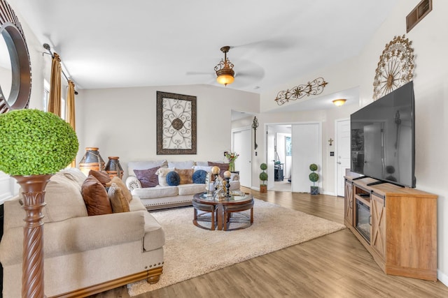 5266 E Harvest Ln, Fresno, CA 93725 - living area with ceiling fan, light wood-type flooring, and vaulted ceiling