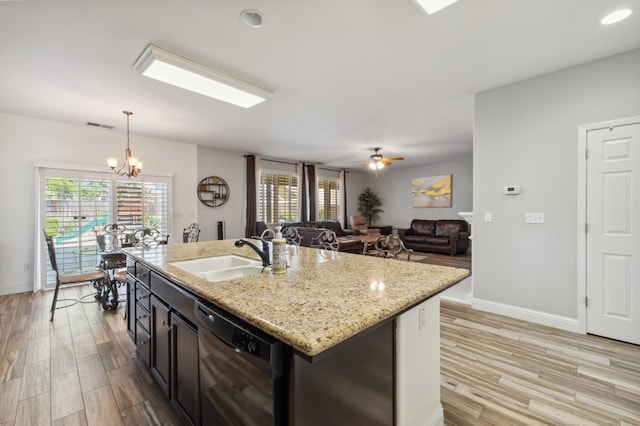 2865 Maine Ave, Clovis, CA 93619 - kitchen featuring a sink, dishwasher, light wood-style floors, and pendant lighting