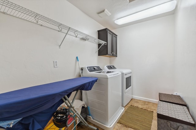 2865 Maine Ave, Clovis, CA 93619 - clothes washing area featuring independent washer and dryer, cabinet space, light tile patterned flooring, and baseboards