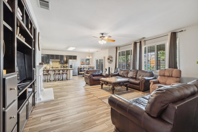 2865 Maine Ave, Clovis, CA 93619 - living room with a ceiling fan and light wood-style flooring