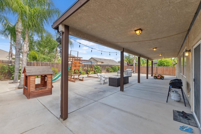 2865 Maine Ave, Clovis, CA 93619 - view of patio / terrace featuring a fenced backyard, outdoor dining area, a playground, and outdoor lounge area