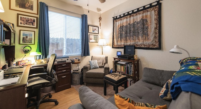 office featuring light wood-style floors and ceiling fan