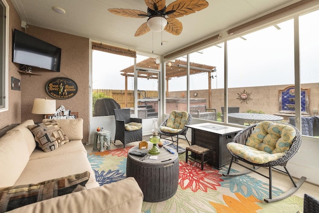 sunroom / solarium with a hot tub, a ceiling fan, and an outdoor hangout area