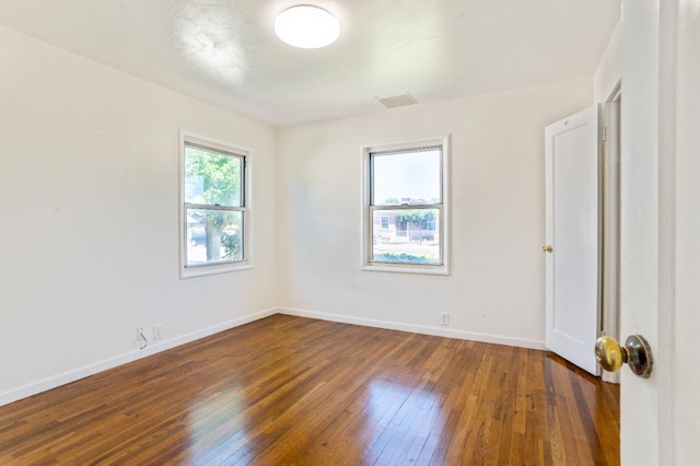 324 E San Mateo St, Avenal, CA 93204 - unfurnished room featuring wood-type flooring and baseboards