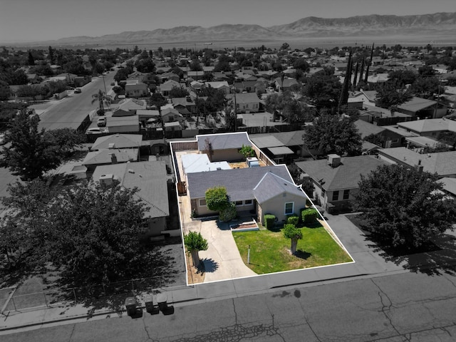 324 E San Mateo St, Avenal, CA 93204 - aerial perspective of suburban area with a mountainous background and property boundaries highlighted