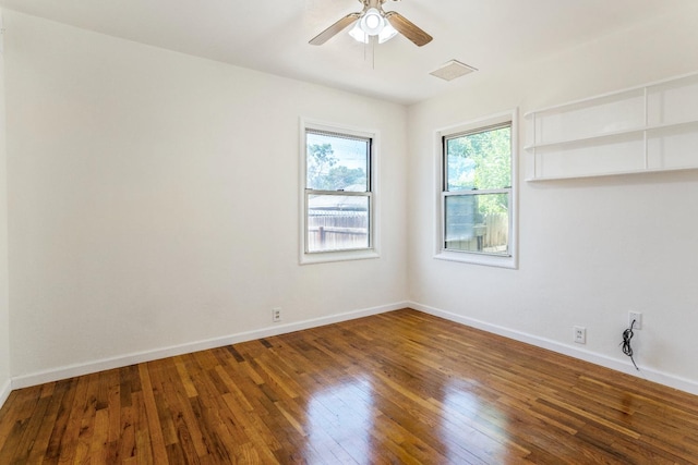 324 E San Mateo St, Avenal, CA 93204 - empty room with wood finished floors, a ceiling fan, and baseboards