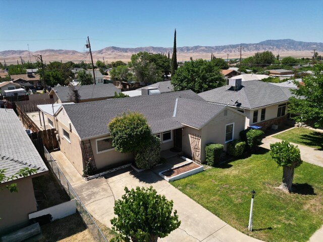 324 E San Mateo St, Avenal, CA 93204 - aerial perspective of suburban area with mountains