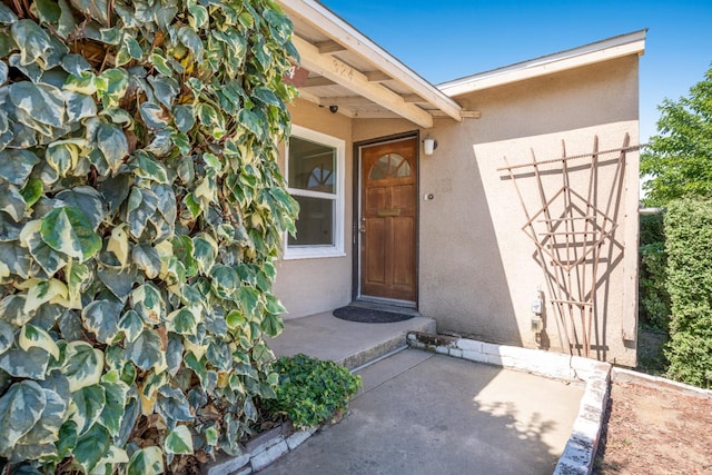 324 E San Mateo St, Avenal, CA 93204 - doorway to property with stucco siding