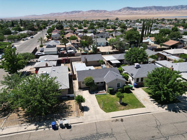 324 E San Mateo St, Avenal, CA 93204 - aerial perspective of suburban area featuring a mountainous background