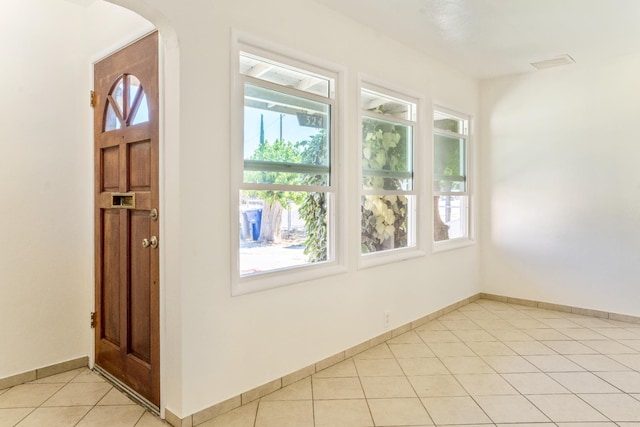 324 E San Mateo St, Avenal, CA 93204 - foyer with light tile patterned flooring, baseboards, and arched walkways
