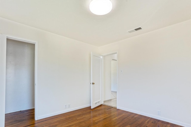 324 E San Mateo St, Avenal, CA 93204 - spare room with wood finished floors and baseboards