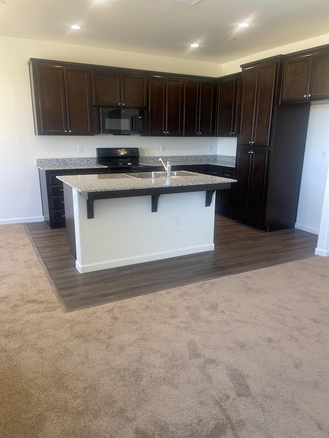 13320 Fourth St Unit Lot1, Parlier, CA 93648 - kitchen with black appliances, a sink, dark colored carpet, light stone counters, and baseboards