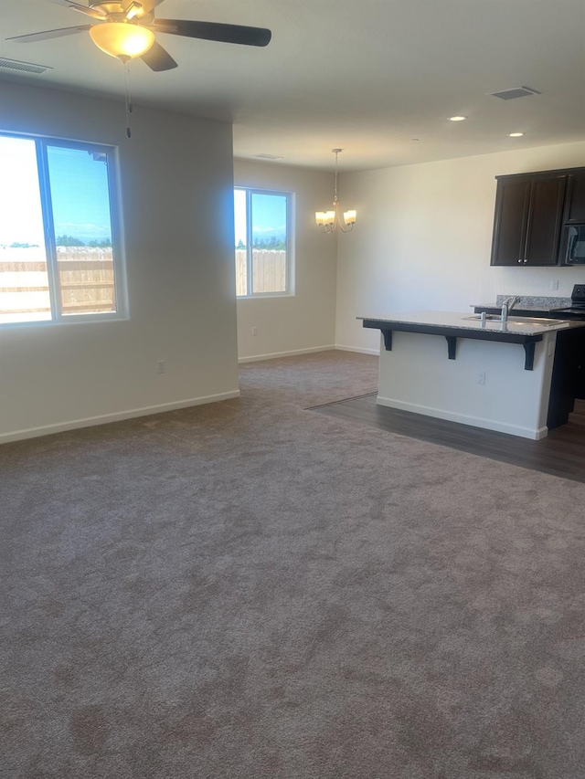 13320 Fourth St Unit Lot1, Parlier, CA 93648 - unfurnished living room with a chandelier, baseboards, a ceiling fan, and recessed lighting
