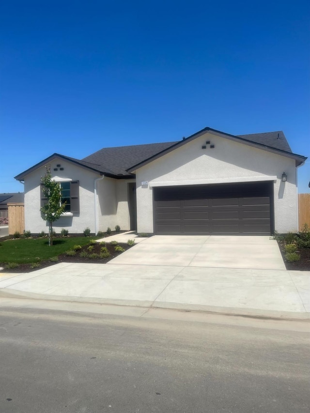 13320 Fourth St Unit Lot1, Parlier, CA 93648 - ranch-style house featuring stucco siding, a garage, and driveway