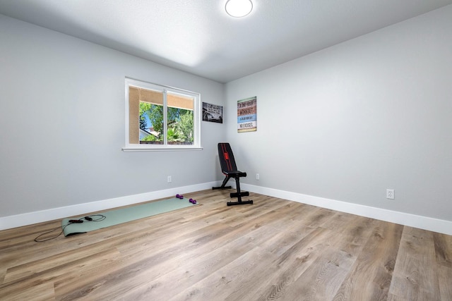 1801 E Omaha Ave, Fresno, CA 93720 - exercise area featuring baseboards and wood finished floors