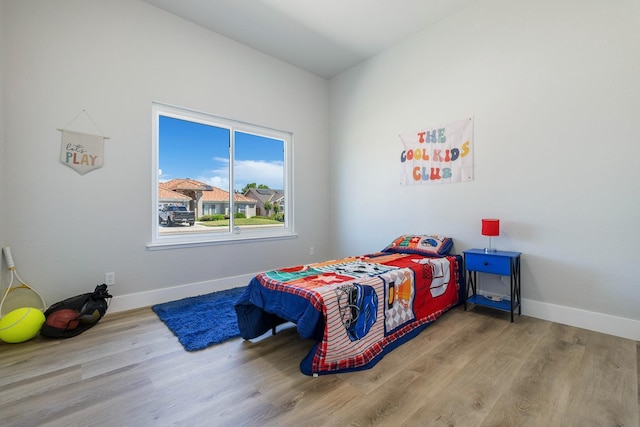 1801 E Omaha Ave, Fresno, CA 93720 - bedroom featuring wood finished floors and baseboards