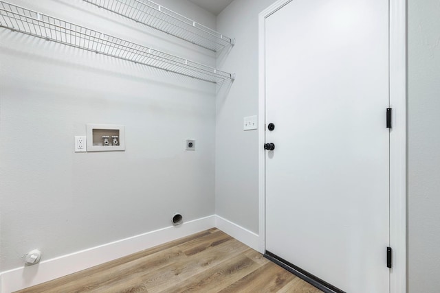 1801 E Omaha Ave, Fresno, CA 93720 - laundry area with hookup for an electric dryer, hookup for a washing machine, light wood finished floors, and baseboards